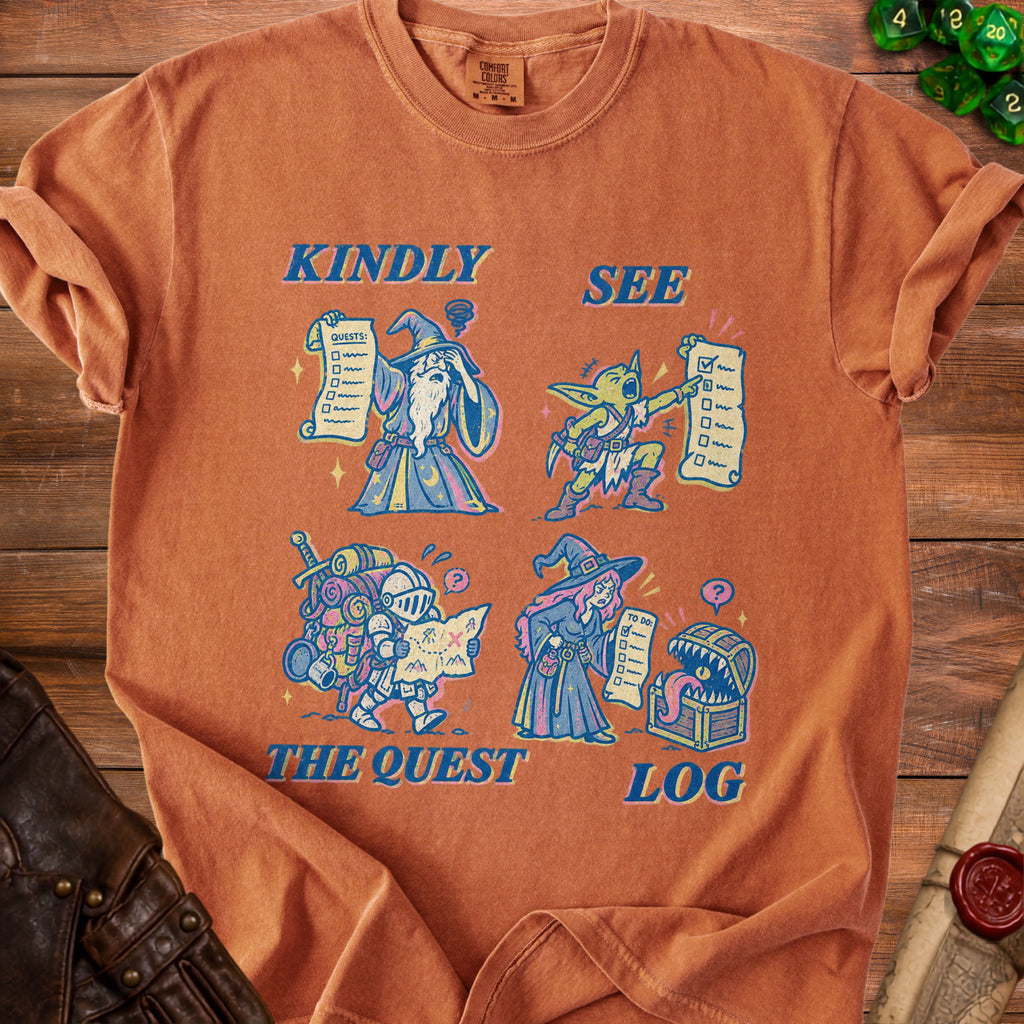Orange t-shirt with fantasy characters and text "Kindly See The Quest Log".