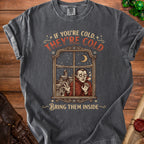 Dark grey t-shirt with a vampire looking through a snowy window, reading "If you're cold, they're cold. Bring them inside."