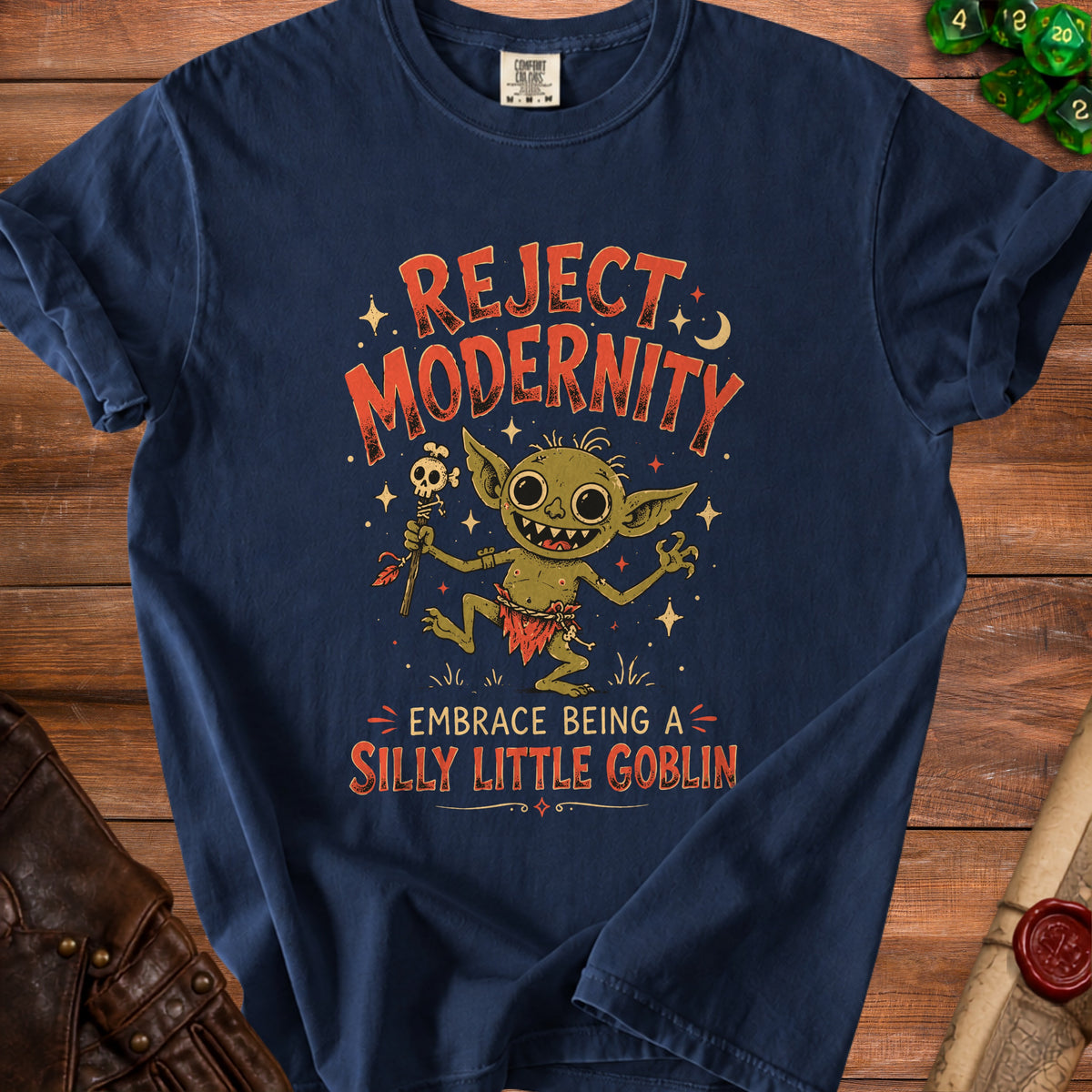Navy t-shirt with "Reject Modernity Embrace Being a Silly Little Goblin" text and a goblin illustration.