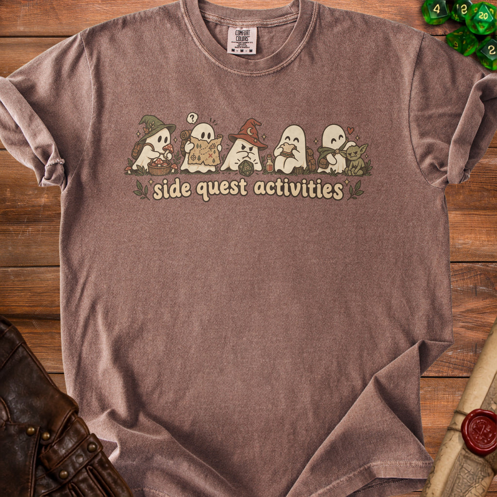 Brown t-shirt with ghosts on a map, wearing a wizard hat, and eating a sandwich.