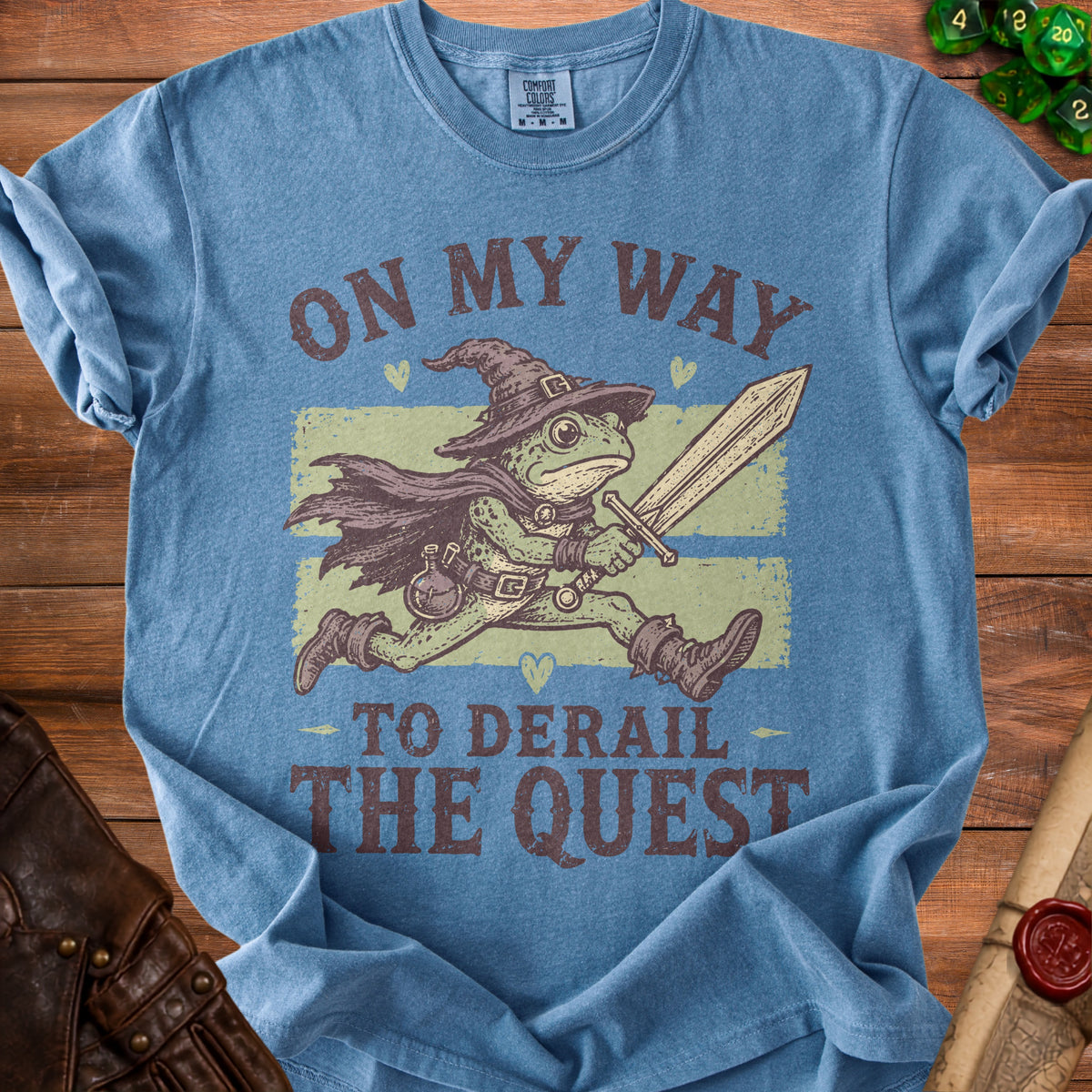 Blue t-shirt with wizard frog holding sword, "On My Way To Derail The Quest" text.
