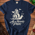 Navy t-shirt with cream graphic of a frog knight on a snail and text "At a Heroic Pace".