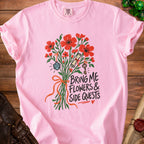 Pink t-shirt with "Bring Me Flowers & Side Quests" text and floral graphic.