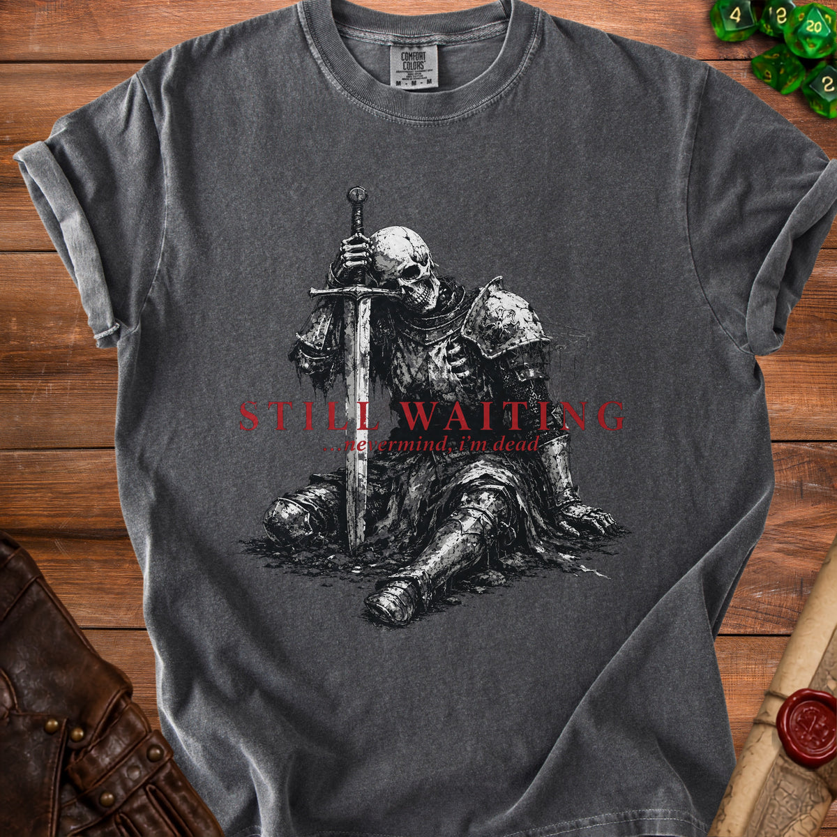 Dark gray t-shirt with skeleton knight graphic and text "STILL WAITING...nevermind, I'm dead."