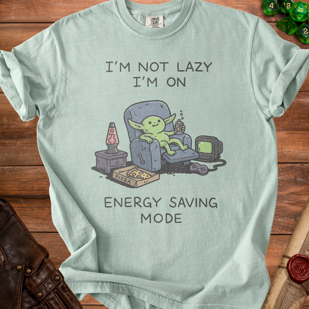 Green t-shirt with cartoon creature text "I'M NOT LAZY I'M ON ENERGY SAVING MODE."