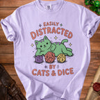 Purple t-shirt with "Easily Distracted by Cats & Dice" graphic.