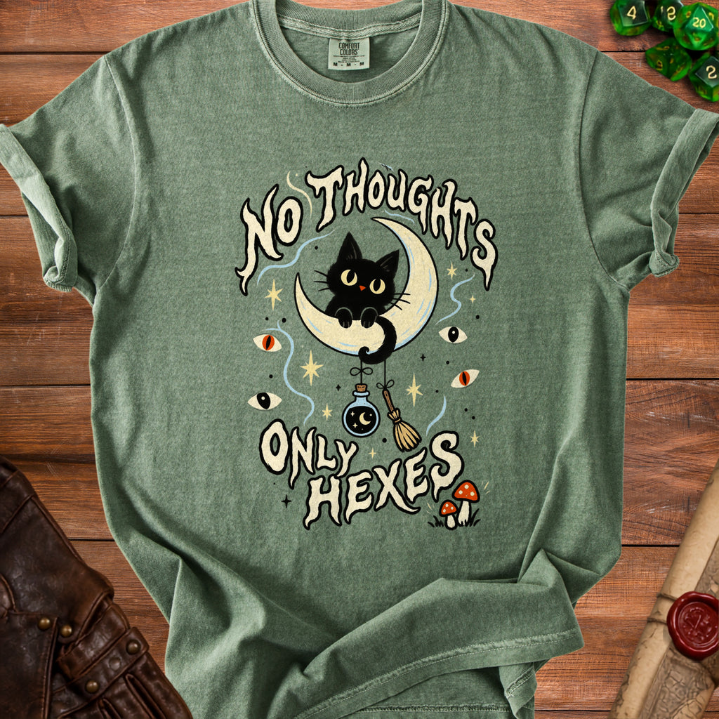 Green t-shirt with a black cat on a moon and "No Thoughts Only Hexes" text.