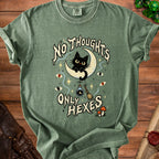 Green t-shirt with a black cat on a moon and "No Thoughts Only Hexes" text.