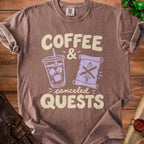 Brown t-shirt featuring the text "COFFEE & canceled QUESTS" with graphics of an iced coffee and a scroll.