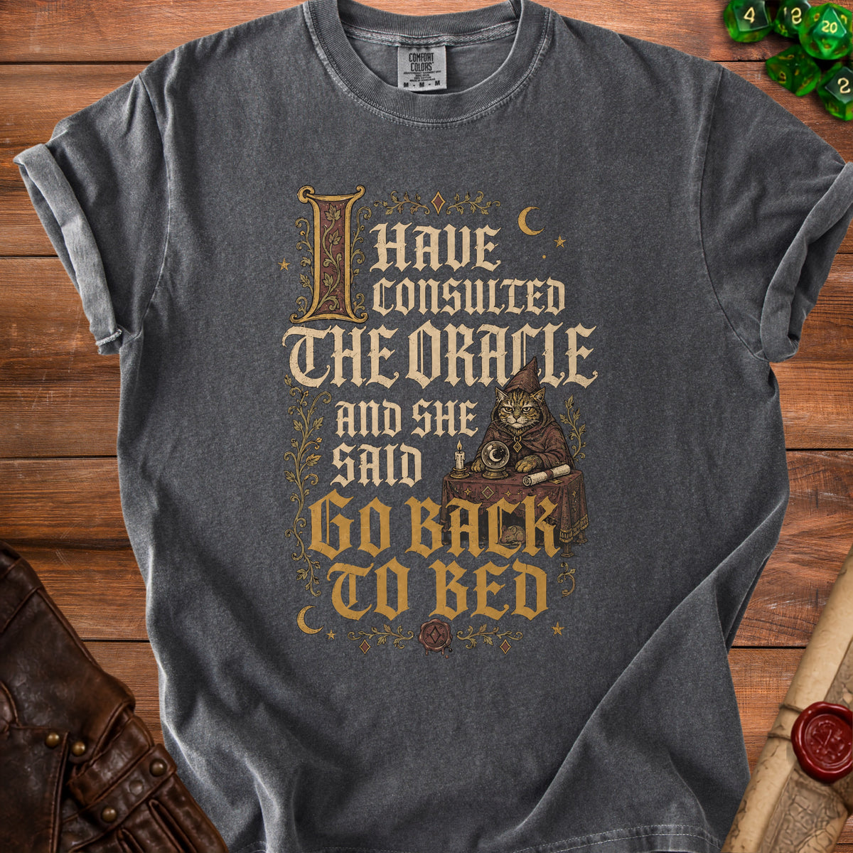 Grey t-shirt with text "I have consulted the oracle and she said go back to bed".