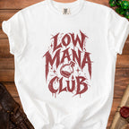 White t-shirt with red "Low Mana Club" text and a potion bottle graphic.