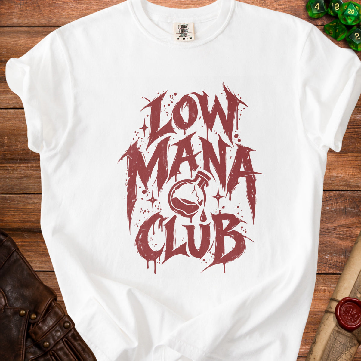 White t-shirt with red "Low Mana Club" text and a potion bottle graphic.