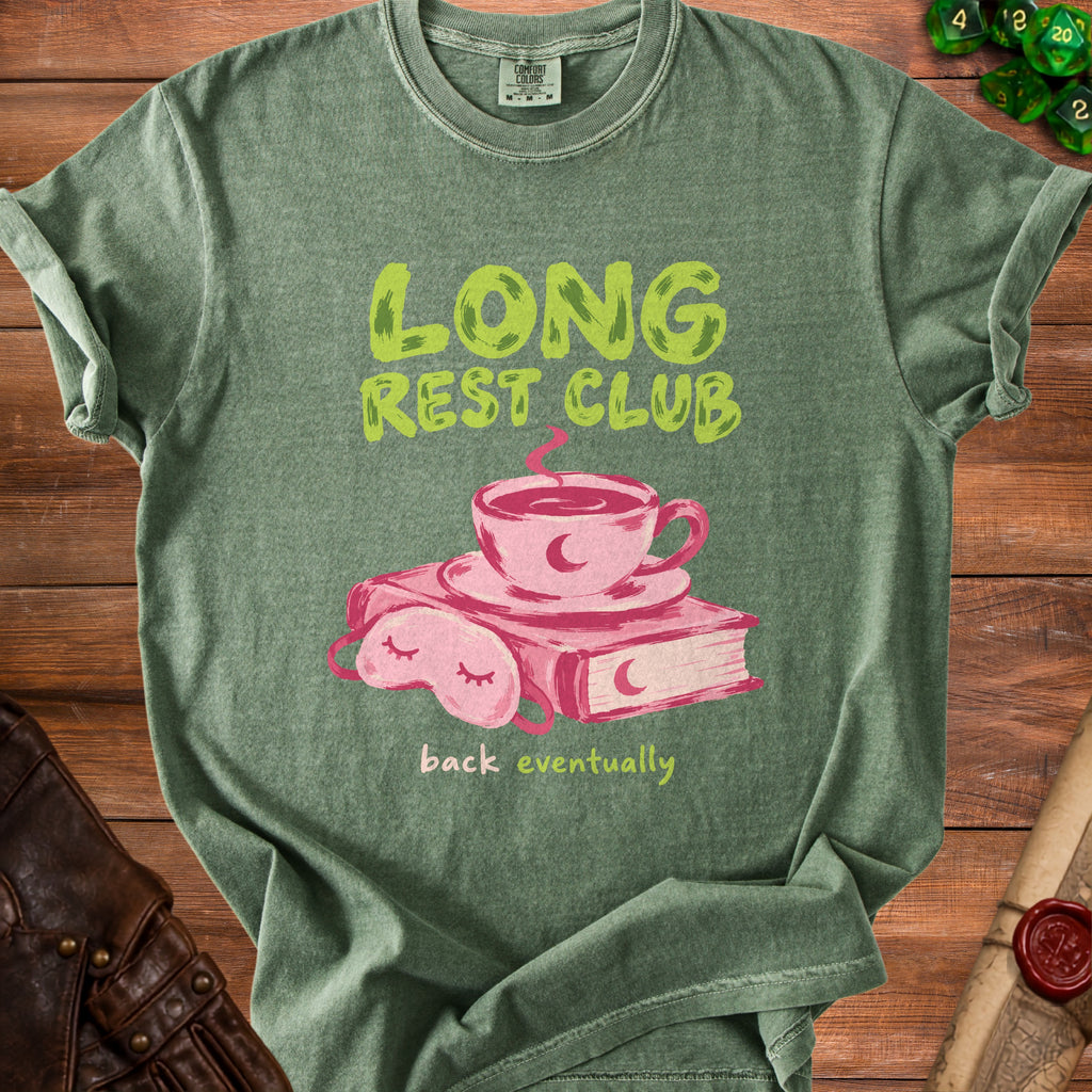 Green t-shirt with "LONG REST CLUB" text, a coffee cup, book, and eye mask.