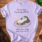Light purple t-shirt with a sleeping penguin graphic and text.