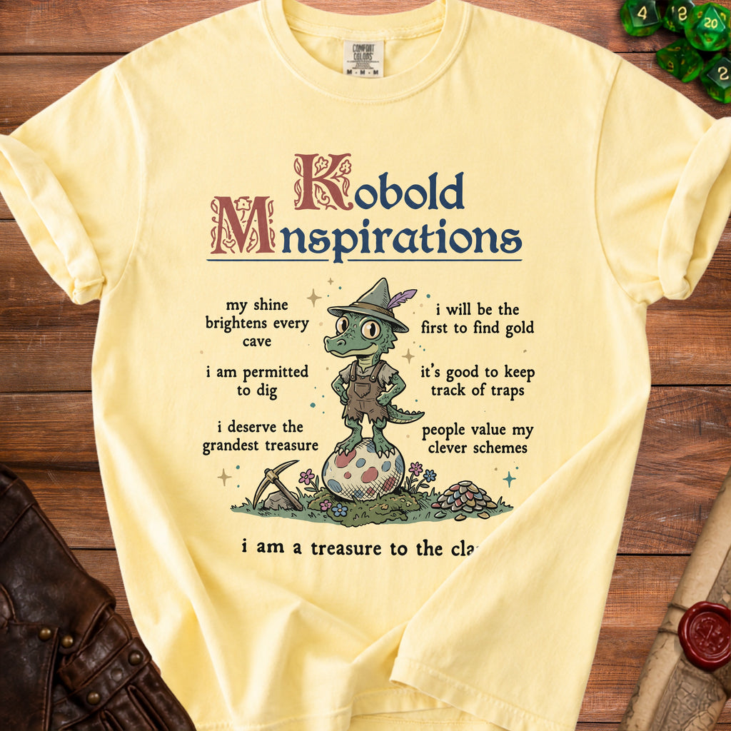 Yellow t-shirt with "Kobold Mnspirations" and illustrations of a kobold.