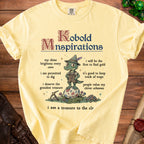Yellow t-shirt with "Kobold Mnspirations" and illustrations of a kobold.