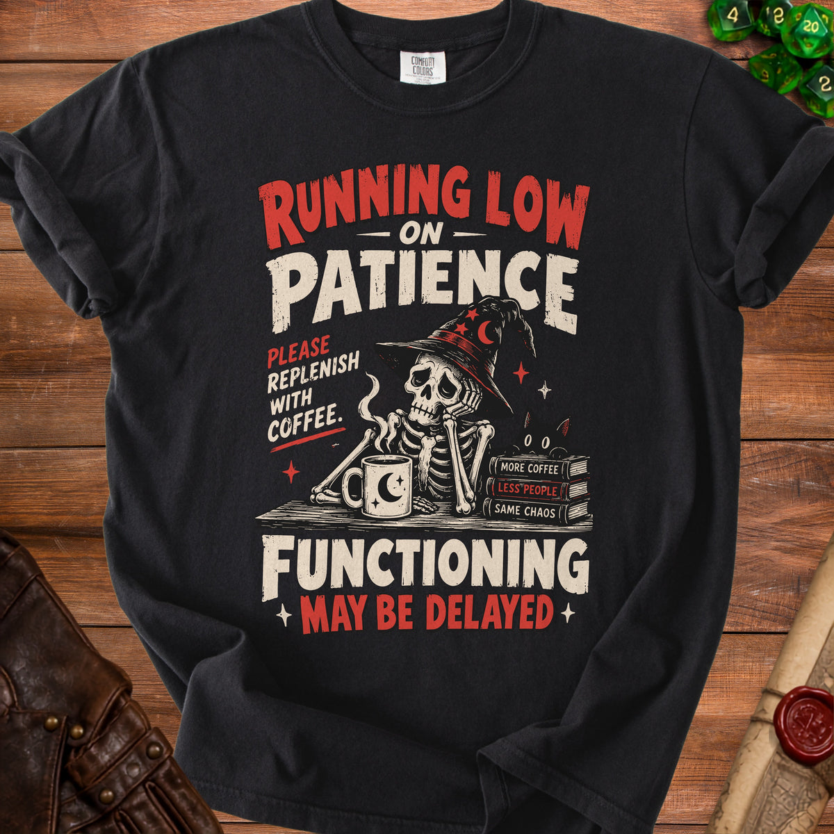 Black t-shirt with skeleton graphic and text: Running low on patience, functioning may be delayed.