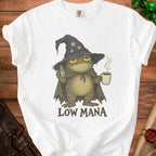 White t-shirt with a cartoon frog wizard holding a potion and coffee mug, text reads "Low Mana".