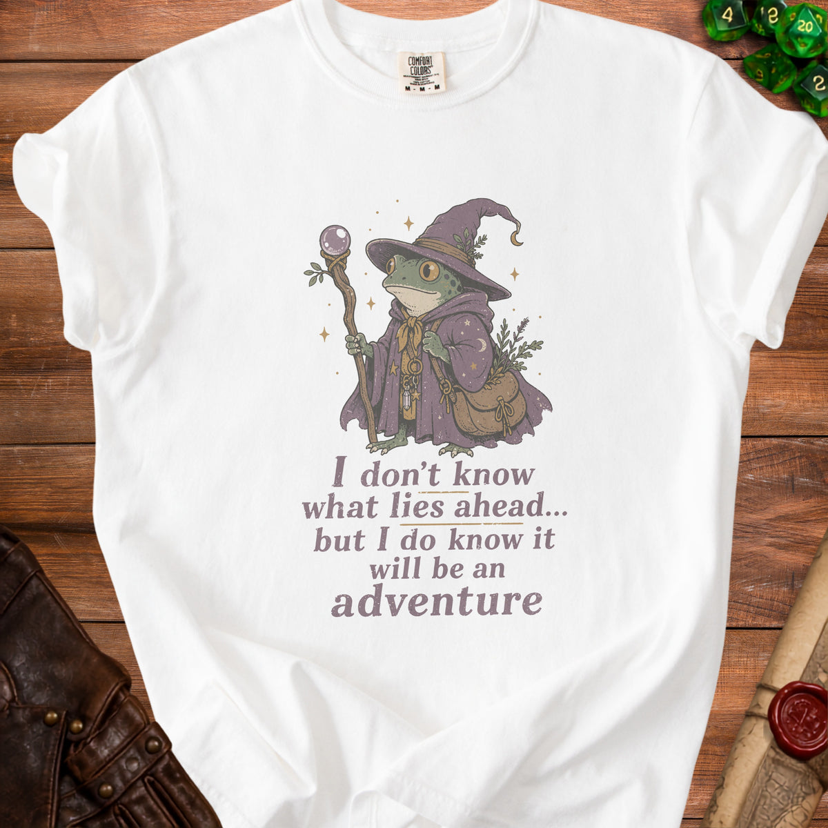 White t-shirt with wizard frog graphic and text "adventure".