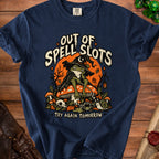 Navy t-shirt with a frog wearing a witch hat and text "OUT OF SPELL SLOTS TRY AGAIN TOMORROW".