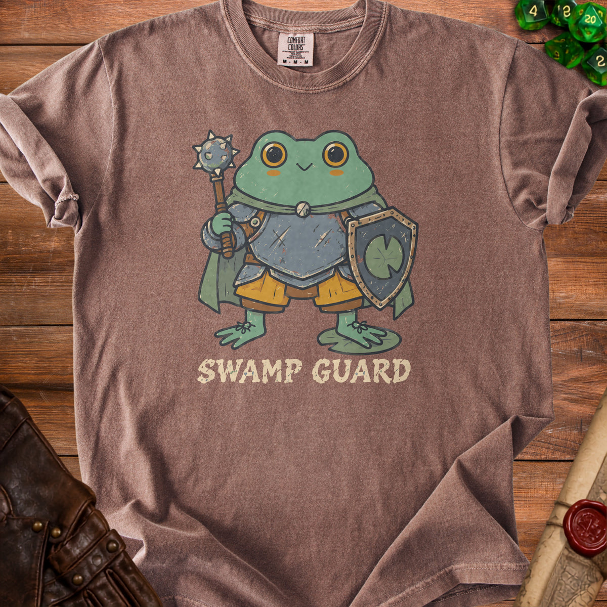 Brown t-shirt with a cartoon frog wearing armor and holding a mace and shield, text reads "SWAMP GUARD".