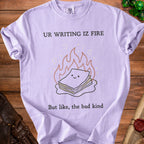 Purple t-shirt with cartoon fire and papers, reads "UR WRITING IZ FIRE But like, the bad kind".