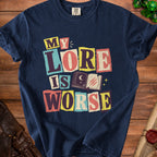 Navy t-shirt with colorful text reading "My Lore is Worse" and an open book.