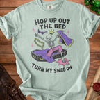 Light blue t-shirt with skeleton text "HOP UP OUT THE BED TURN MY SWAG ON".