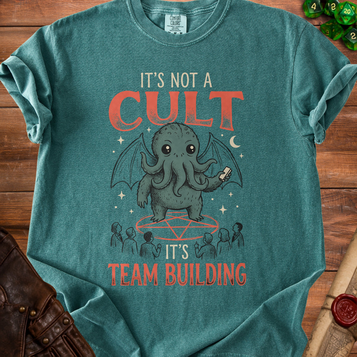 Teal t-shirt with Cthulhu illustration and "It's Not A Cult, It's Team Building" text.