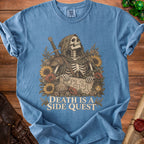 Skeleton in hooded robe holds map with dice and lantern, text reads "Death is a Side Quest".