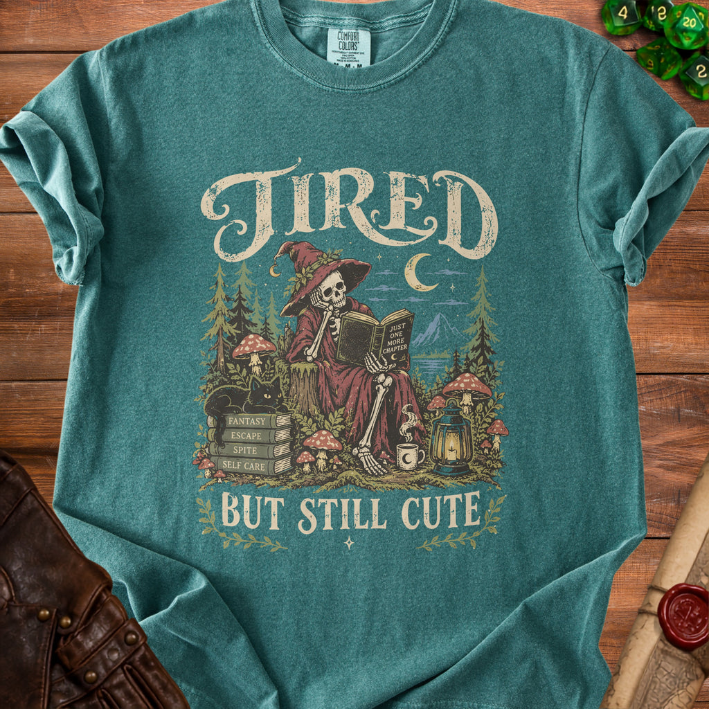 Tired but still cute graphic tee with skeleton witch reading a book.