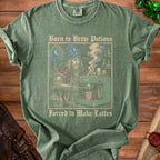 Green t-shirt with wizard making coffee. Text reads "Born to Brew Potions Forced to Make Lattes".