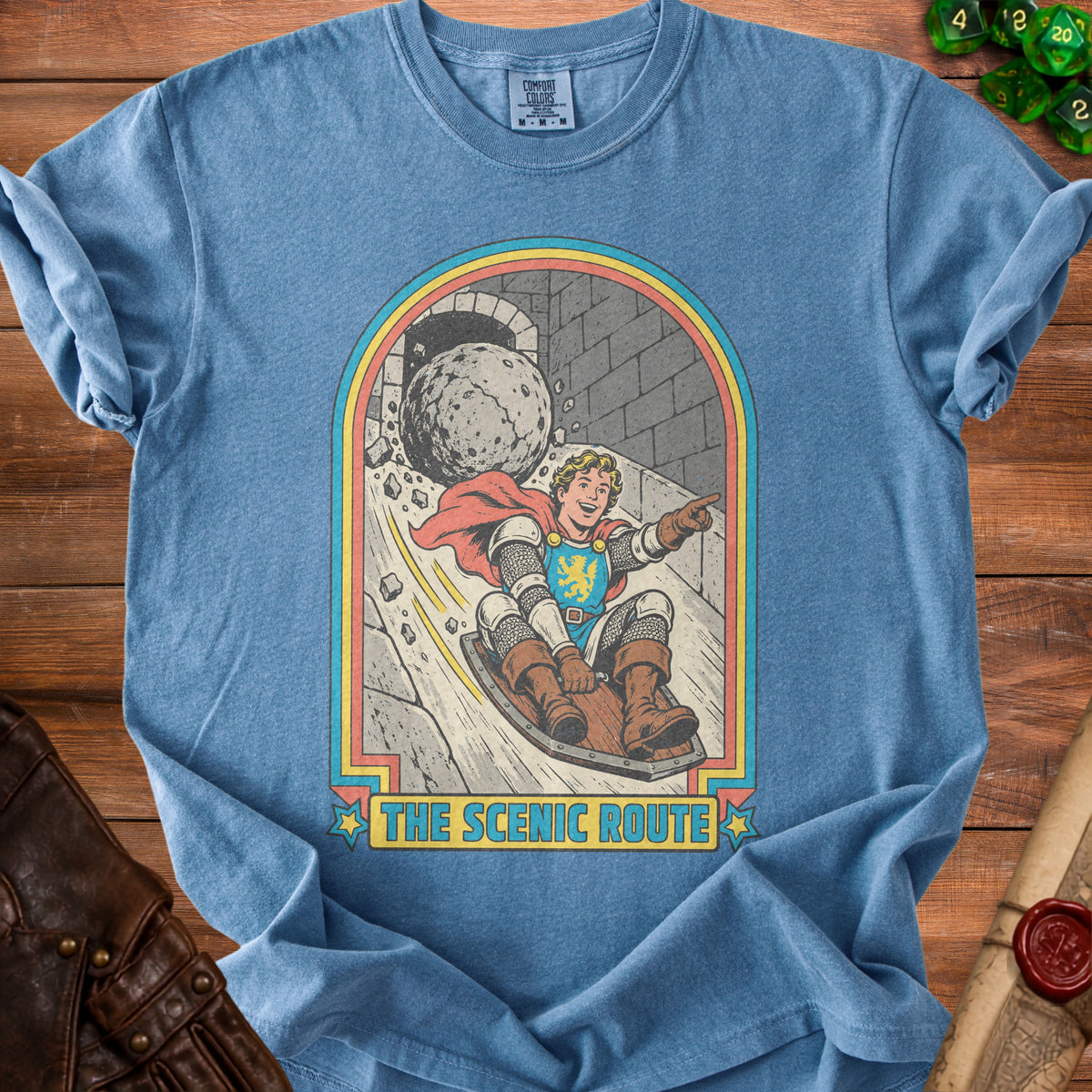 Knight on sled chased by boulder, with text "THE SCENIC ROUTE".