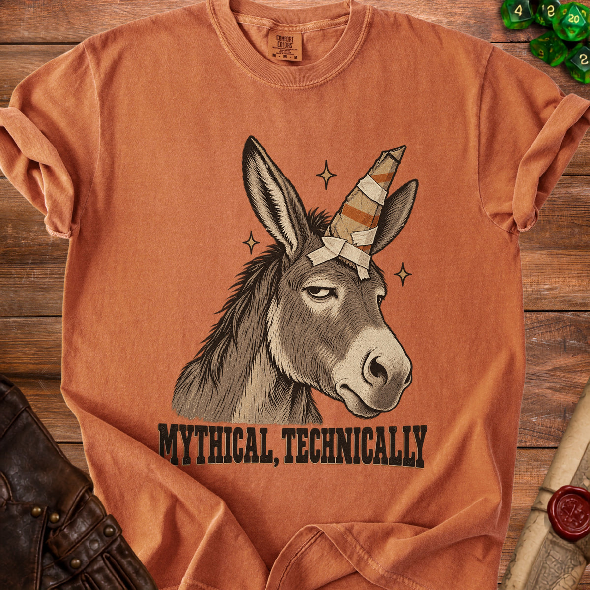 Donkey with a bandaged unicorn horn and "Mythical, Technically" text.