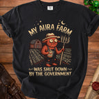 Black t-shirt graphic with text "My Aura Farm Was Shut Down By The Government".