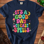 Navy t-shirt with "It's a good day to cast spells" text and whimsical illustrations.