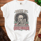 White t-shirt with skeleton overthinking graphic and text "DEATH BY OVERTHINKING".