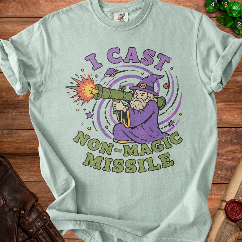 Light blue t-shirt with wizard holding a rocket launcher and "I CAST NON-MAGIC MISSILE" text.