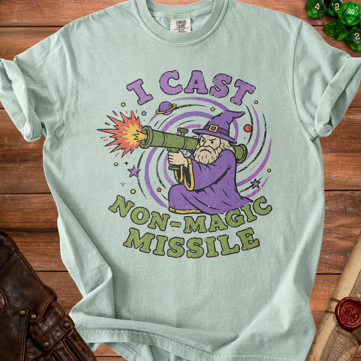 Light blue t-shirt with wizard holding a rocket launcher and "I CAST NON-MAGIC MISSILE" text.