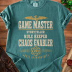 Teal t-shirt with "GAME MASTER STORYTELLER RULE KEEPER CHAOS ENABLER ROLL RESPONSIBLY" text.