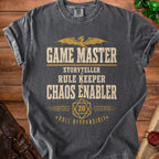Dark gray t-shirt with "Game Master Storyteller Rule Keeper Chaos Enabler" text and dragon graphic.