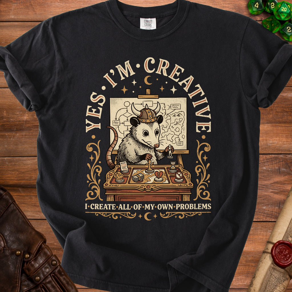 Opossum wearing a Viking helmet, planning on a map. Text says "YES. I'M CREATIVE. I CREATE ALL OF MY OWN PROBLEMS."