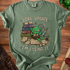 Goblin character with books and scrolls reading "Lore Update: I'm Losing It."