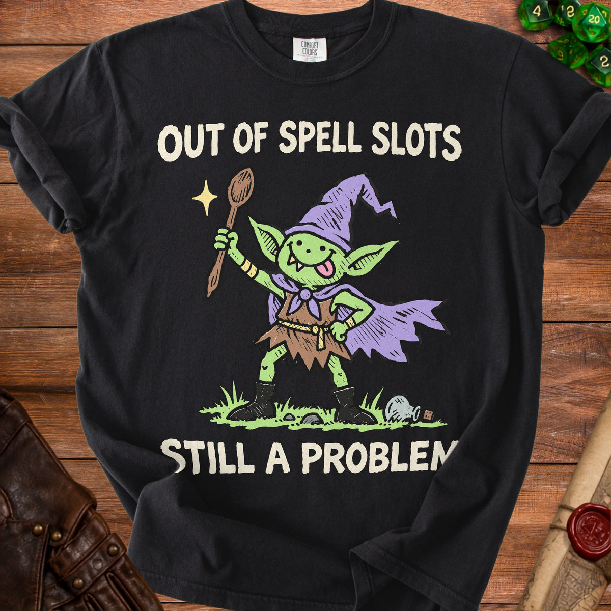 Black t-shirt with a goblin graphic and text "OUT OF SPELL SLOTS STILL A PROBLEM".