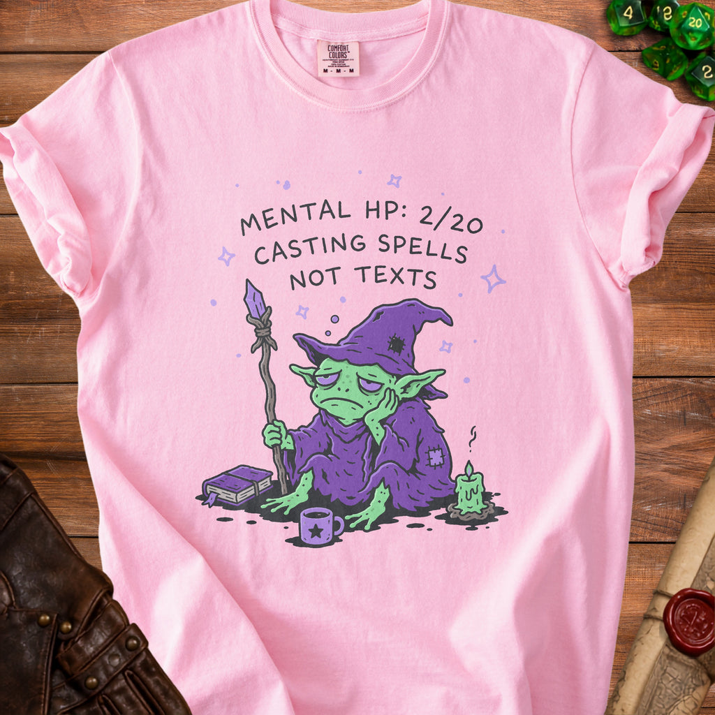 Pink t-shirt with a tired goblin casting spells, text "Mental HP: 2/20 Casting Spells Not Texts."