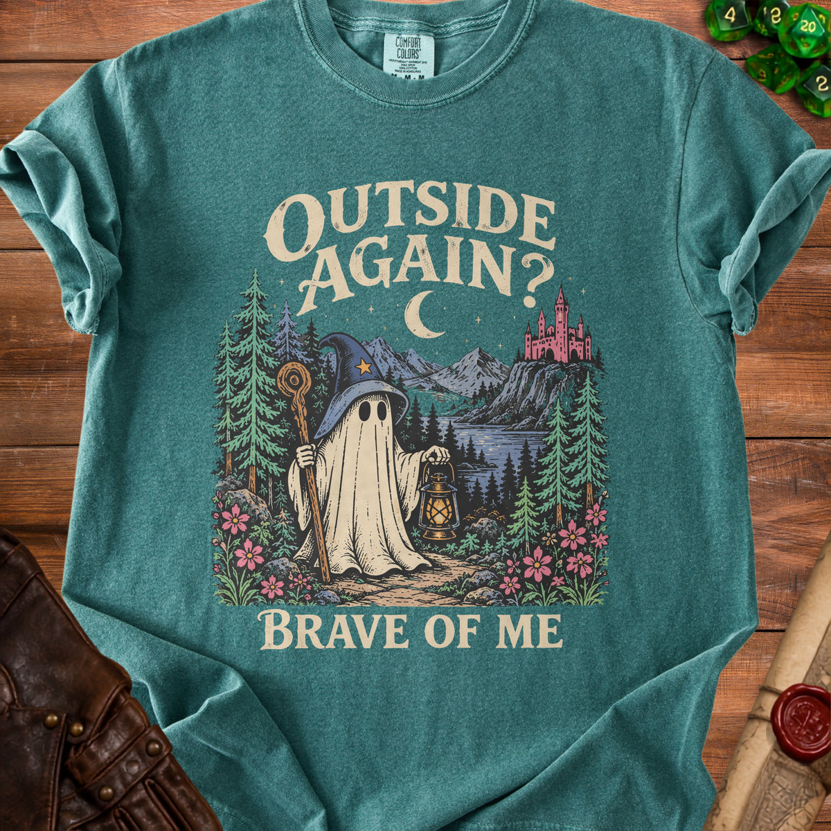 T-shirt graphic of a ghost in a wizard hat holding a lantern, with text "OUTSIDE AGAIN? BRAVE OF ME".