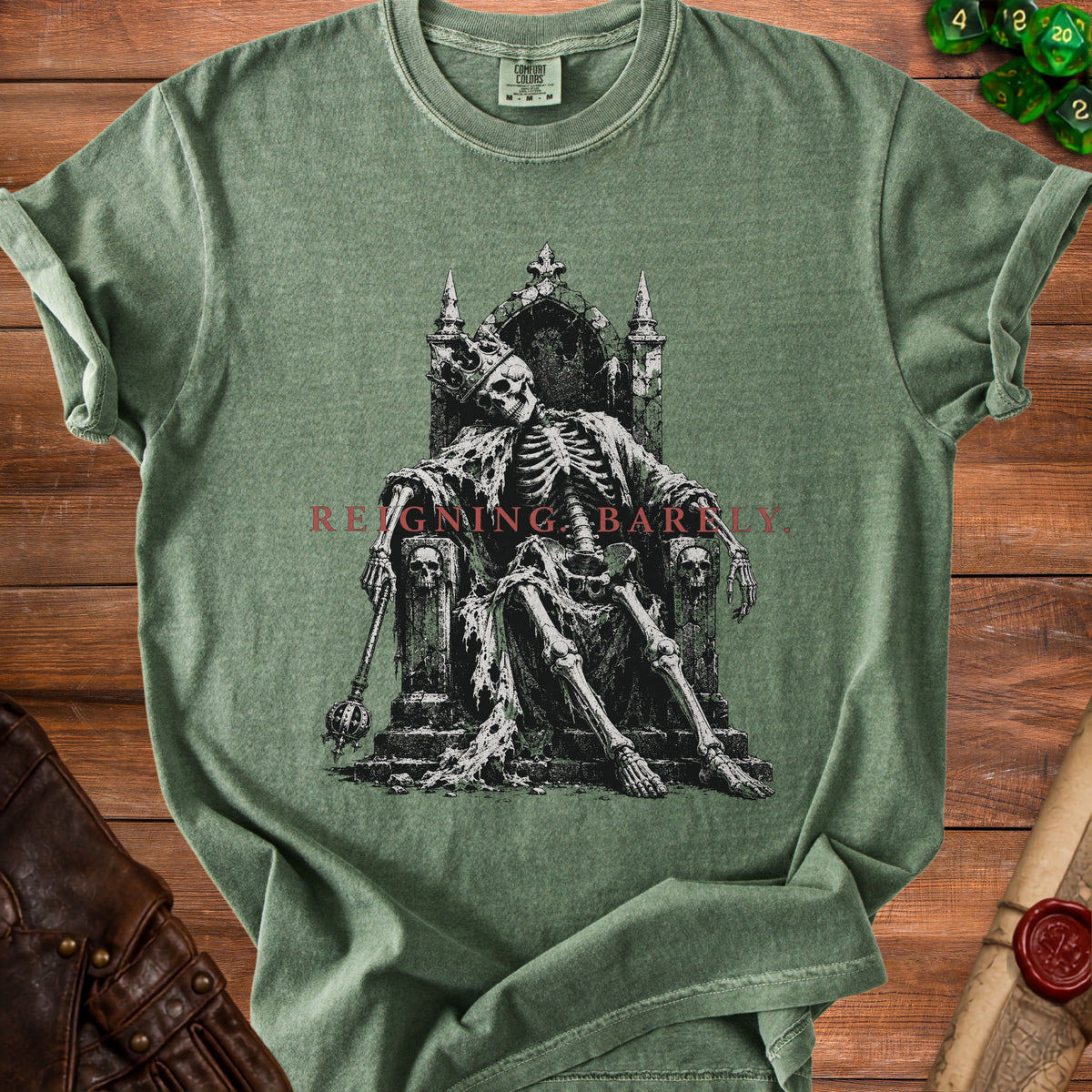 Green t-shirt with a skeleton king graphic and text "REIGNING BARNILY".