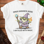 White t-shirt with goblin wizard illustration and text "I AM FILLED WITH MAGIC".