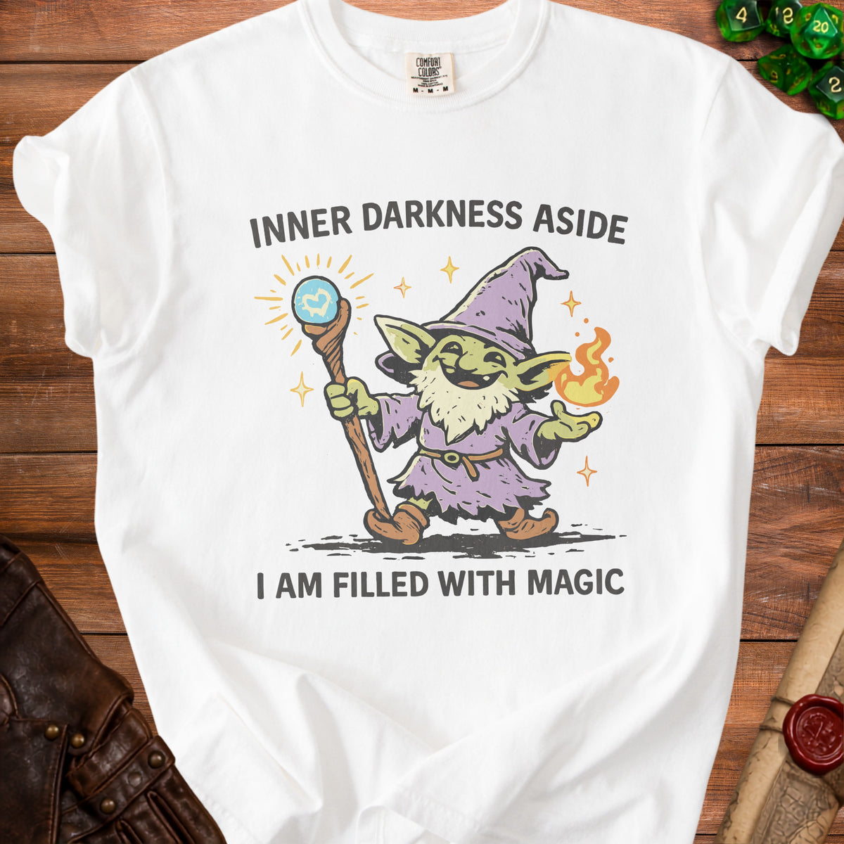 White t-shirt with goblin wizard illustration and text "I AM FILLED WITH MAGIC".
