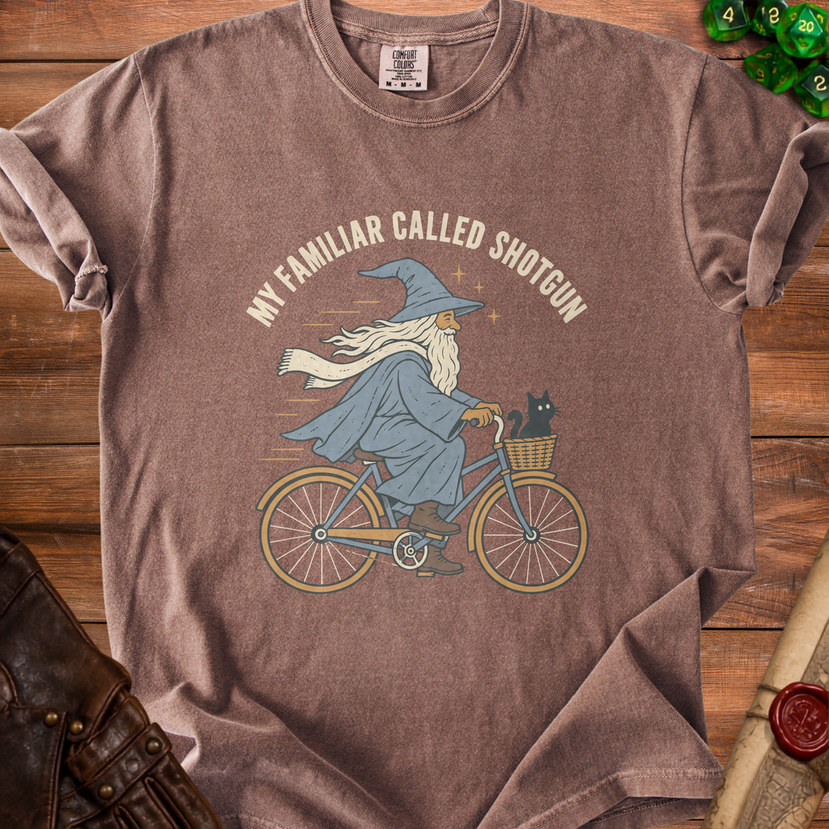 T-shirt with illustration of wizard riding bicycle with cat, text "MY FAMILIAR CALLED SHOTGUN".